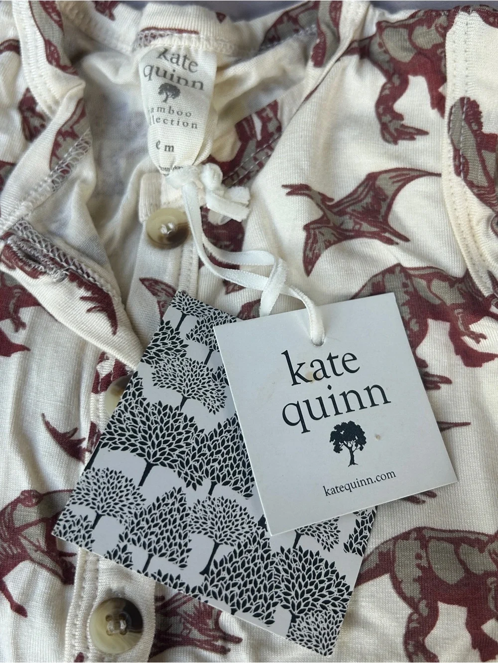 Kate Quinn cream sleeveless dinosaur romper